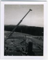 North Grounds Phase II Construction; Extended Crane puts first steel form up; 15 Feb. 1977