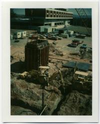 North Grounds Phase II Construction; Backhoe forming the north stairwell; 17 March 1977