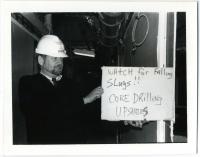 Bill Bergen Holding Sign During Construction Renovations; March 1996
