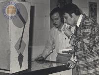 Robert E. Scott and William McKee Playing Pinball, 1975