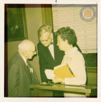 Law School Dean Monrad Paulsen and Library Benefactor Arthur J. Morris Present the 200,000th Volume to Frances Farmer 